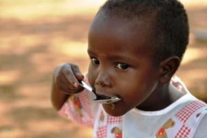 african-child-eating-from-childfund-dot-org-dot-nz