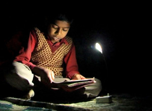 boy-studying-with-solar-LED-light